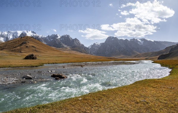 Mountain landscape with yellow meadows and river Kol Suu, mountain peak with glacier, hike to the mountain lake Kol Suu, Keltan Mountains, Sary Beles Mountains, Tien Shan, Naryn Province, Kyrgyzstan, Asia