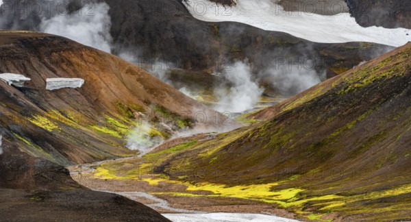 Colourful volcanic landscape with hills and snow, volcanic steaming hot springs, Laugavegur trekking trail, Landmannalaugar, Fjallabak Nature Reserve, Icelandic Highlands, Suðurland, Iceland, Europe