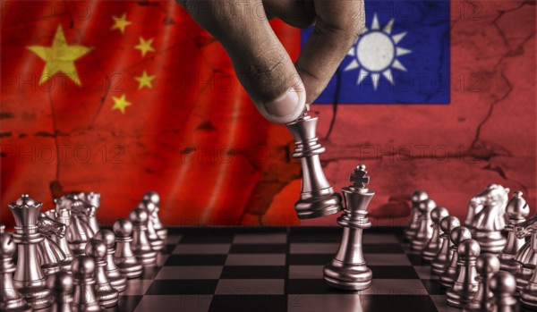 China vs Taiwan flag concept on chessboard. Political tension between China and Taiwan on pieces of chessboard