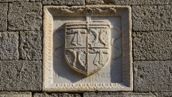 Small square stone relief with a coat of arms and a partially legible inscription, Knights' Street, Rhodes Old Town, Rhodes Town, Rhodes, Dodecanese, Greek Islands, Greece, Europe