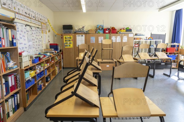 Classroom of a fourth grade, after school, the building is older but in good condition, modern teaching materials