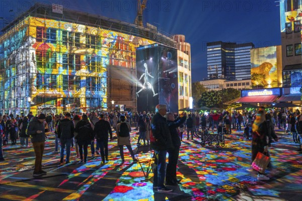 Essen Light Festival, in the city centre, light art on Kennedyplatz, the Berlin artist Daniel Margraf illuminates the large square in the city centre with works of art from the Essen Folkwang Museum, the visitors become part of the pictures that change with every step. North Rhine-Westphalia, Germany, Europe