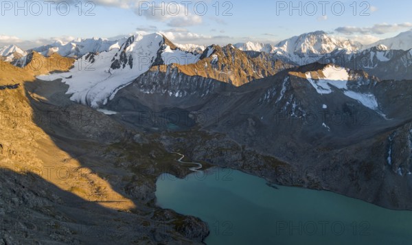 Evening mood, mountain panorama, aerial view, 4000 metre peak with glacier, mountain pass and mountain lake Ala-Kul Lake, Tien Shan, Kyrgyzstan, Asia