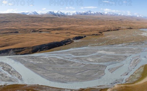 Aerial view, Burkhan mountain valley with meandering river, barren dramatic mountain landscape, Terskey Ala-Too, Tien Shan, Issyk Kul province, Kyrgyzstan, Asia