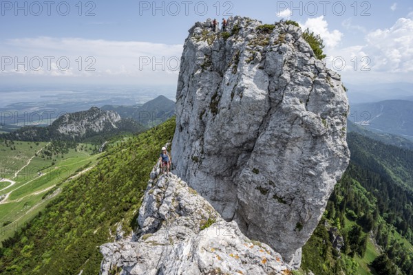 Climber with climbing rope on a climbing tour, climber on a mountain ridge, alpine climbing, crossing the Kampenwand, Chiemgau, Bavaria, Germany, Europe