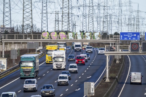 A57 motorway near Kaarst in the Rhine district of Neuss, view in the direction of the Kaarst motorway junction, heavy traffic, overhead power lines, along the motorway, North Rhine-Westphalia, Germany, Europe