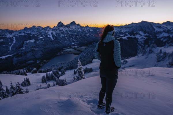 Hiking in the snow in the snow-covered winder landscape in the Alps at Neunerköpfle in the Tannheimer Tal in Tyrol, Austria, Europe