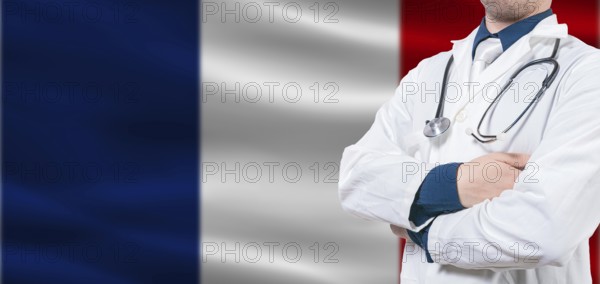 France Health and Care concept. Male doctor on France flag. Doctor with crossed arms on France flag