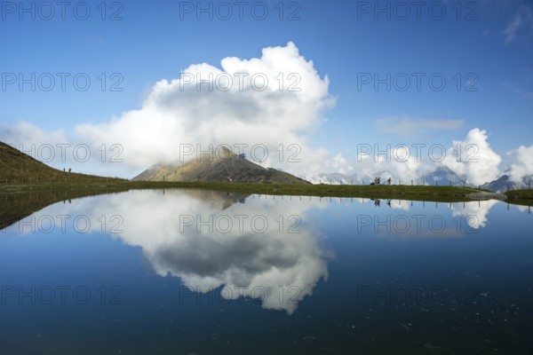 Artificially created lake, snow pond, feeds the snow cannons that completely cover the slopes of the Fellhorn and Kanzelwand cable cars with snow, behind it the Fellhorn, 2038m, Allgaeu, Allgaeu Alps, Bavaria, Germany, Europe