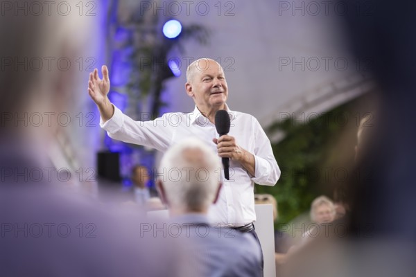 Olaf Scholz (Chancellor of the Federal Republic of Germany, SPD) surrounded by guests at the Chancellor's meeting at ufaFabrik in Berlin on 4 September 2024