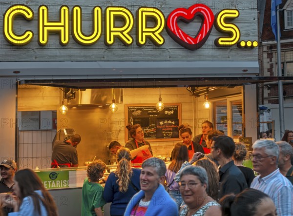 Churros stall selling fried choux pastry dough during the Gentse Feesten, Ghent city festival, summer festivities in Flanders, Belgium, Europe
