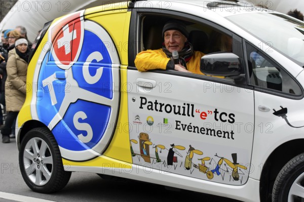 Support vehicle sponsored by the Touring Club Switzerland, TCS, with the course announcer at the Escalade city run, Geneva, Switzerland, Europe