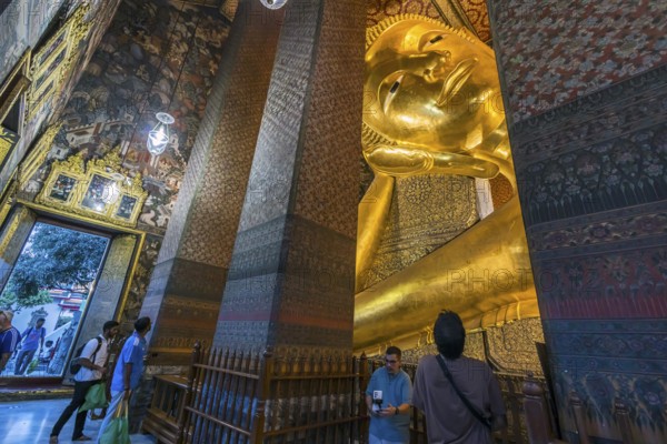 Wat Pho, temple of the reclining Buddha. Sightseeing attraction, architecturally significant temple complex. It is home to Phra Buddhasaiyas. The gilded Buddha statue is 46 metres long and 15 metres high. Bangkok, Thailand, Asia