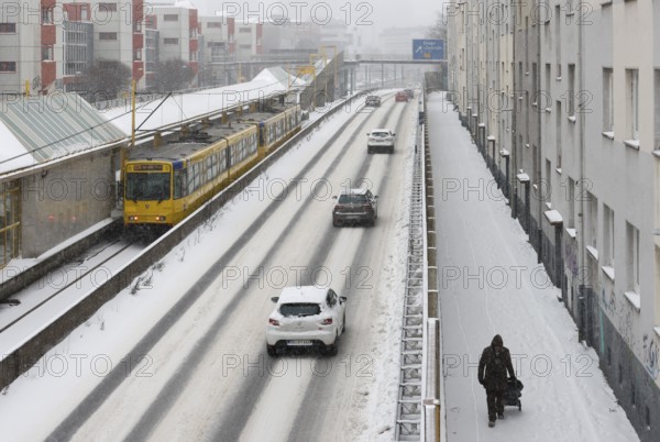 Essen, North Rhine-Westphalia, Germany - Onset of winter in the Ruhr area, few cars driving on the A40 motorway in ice and snow, underground at the stop