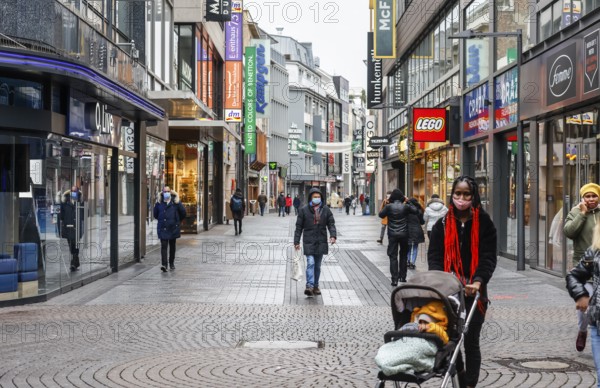 Cologne, North Rhine-Westphalia, Germany - Cologne city centre in times of the corona crisis during the second lockdown, the shops are closed, only a few passers-by stroll along Hohe Straße on Friday afternoon