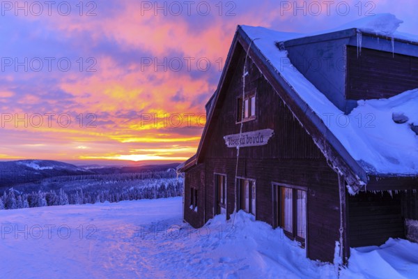 Sunset at the Wossecker Baude on a winter's day, Harrachsdorf in the Giant Mountains, Czech Republic, Europe