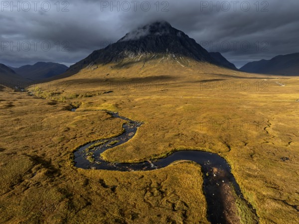 Morning light, cloudy mood, sunbeams, river, moor, mountain landscape, aerial view, autumn, view of Buachaille Etive Mòr, Glencoe, Scottish Highlands, Scotland, Great Britain
