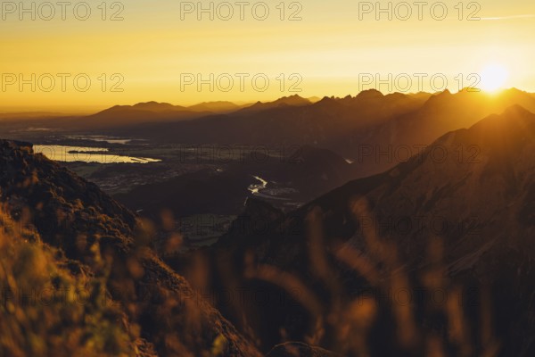 View from the Aggenstein and the foothills of the Alps in Ostallgäu and the Ammergebirge at sunrise, Bavaria, Germany, Europe