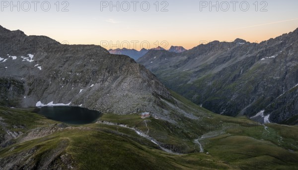 Mountain basin with mountain hut Neue Reichenberger Hütte and Bödensee, view from Bachlenkenkopf at sunrise, Lasörlinggruppe, Hohe Tauern National Park, East Tyrol, Tyrol, Austria, Europe