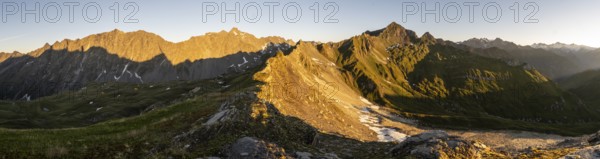Panorama, mountain landscape at sunrise, view of mountain peaks of the Venediger group, into the Großbachtal valley and of the Panargenkamm ridge in the morning light, from the summit of Bachlenkenkopf, Lasörling group, Hohe Tauern National Park, East Tyrol, Tyrol, Austria, Europe