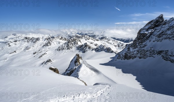 Mountain ridge of Piz Kesch, ascent on Piz Kesch or Piz d'Es-cha in winter, spectacular mountain landscape, view of mountain panorama with glacier Vadret da Porchabella, Albula Alps, Rhaetian Alps, Grisons, Eastern Switzerland, Switzerland, Europe