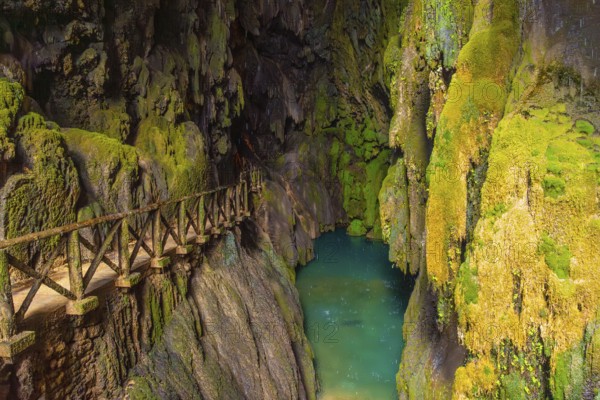 Beautiful colours inside the Iris Grotto at the Cola de Caballo Waterfall in the Monasterio de Piedra Natural Park, Aragon