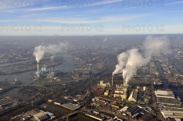 Inversion weather situation in Hamburg. An inversion is a weather situation characterised by a reversal (Latin: inversio) of the vertical temperature gradient: the upper layers of air are warmer than the lower ones. As a result, the air temperature rises with altitude, which influences the stratification stability of the troposphere and in particular all convective processes. The area in which this inversion occurs is known as the inversion layer..updraft aerial photographs/ Keywords: Europe, Germany, Hamburg, Tiefstack thermal power station, Borsigstrasse waste incineration plant, smoke, fumes, exhaust fumes, environmental capital, inversion, air pollution, overview, survey, updraft aerial photographs, aerial photograph, aerial photography..c o p y r i g h t : A U F W I N D, L U F T B I L D E R, de.G e r t r u d, B a e u m e r, S t i e g 1 0 2, .2 1 0 3 5 H a m b u r g, G e r m a n y.P h o n e + 4 9 (0) 1 7 1, 6 8 6 6 0 6 9 .E m a i l H w e i 1 @ a o l, c o m.w w w w, a u f w i n d, l...
