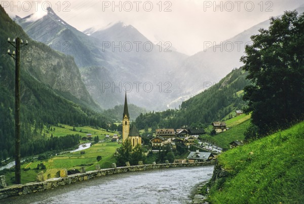 Village of Heiligenblut and Großglockner massif Alpine mountain range, Spittal an der Drau, Carinthia, Austria, Europe, 1950s, Europe
