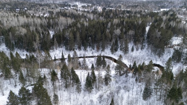 River in the boreal forest in winter. Region of La Mauricie. Province of Quebec. Canada