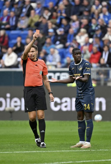 Referee Tobias Reichel shows Stanley Nsoki TSG 1899 Hoffenheim (34) red card red sending off, PreZero Arena, Sinsheim, Baden-Württemberg, Germany, Europe