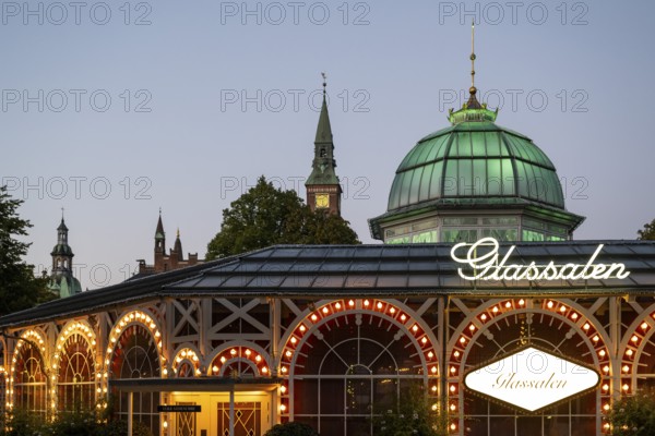 Illuminated theatre hall Glass Hall or Glassalen, architect Poul Henningsen, dusk, Tivoli Amusement and Recreation Park, Copenhagen, Denmark, Europe