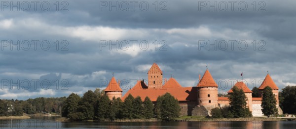 Island castle in Trakai, Lithuania with a cloudy sky in the background