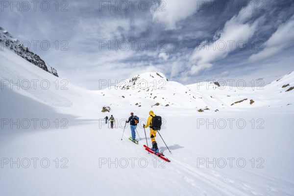 Ski tourers ascending from the Iffigtal to the Wildhornhütte, snow-covered mountain landscape, Bernese Alps, Bernese Oberland, Switzerland, Europe
