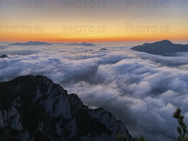Sunset in the Chiemgau Alps with fog in the valley, view of Geigelstein, Kampenwand and Hochgern, Bavaria, Germany, Europe