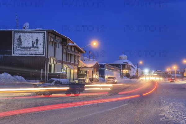 Snowy road, city, cars, buildings, cold, snow, twilight, moonlight, Arctic, Inuit settlement, Inuvik, Northwest Territories, Canada, North America