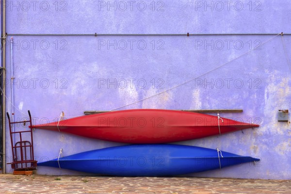 Two paddle boats attached to a wall, Burano, Veneto, Italy, Europe