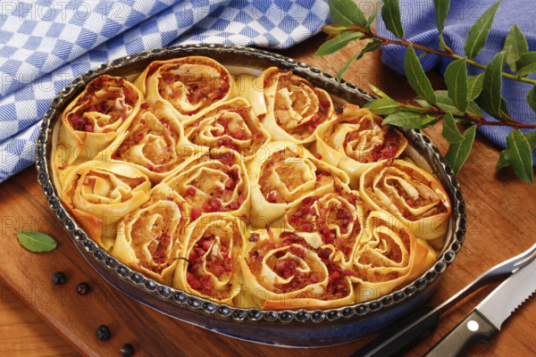Swabian cuisine, Swabian doughnuts in a casserole dish, Swabian pasta sack, stuffed pasta pancakes with sauerkraut and smoked meat, savoury, salty, main course, raw pasta pancakes, grandmother's cooking, regional, home cooking, typical Swabian, traditional cuisine, food photography, studio, Germany, Europe