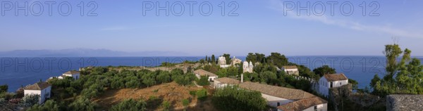 Wide panorama of the whole complex, with church and trees, the sea stretches to the horizon, Koroni, Byzantine fortress, nunnery, Peloponnese, Greece, Europe