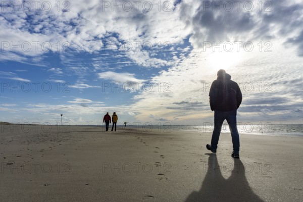 North Sea, Spiekeroog Island, autumn, strong wind drives the sand over the mudflats at low tide, beach walker, west coast of the East Frisian Island, Lower Saxony, Germany, Europe