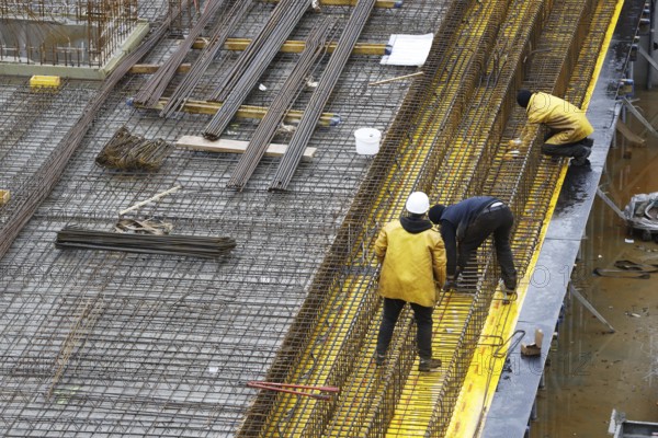Construction site, reinforced concrete reinforcement bars, for a building ceiling, are installed
