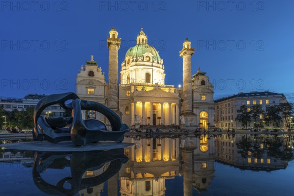 Sculpture by Henry Moore Hill Arches and the Karlskirche in Vienna at dusk, Austria, Europe