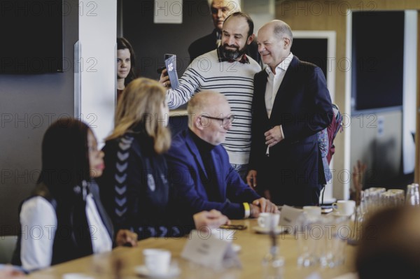 Olaf Scholz (SPD), Federal Chancellor, at a meeting with migrants and people involved in the field at SV Babelsberg in Potsdam, 26 February 2024
