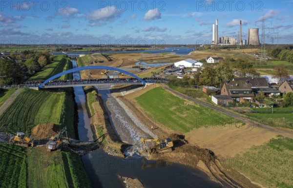 Dinslaken, Voerde, North Rhine-Westphalia, Germany, Inauguration of the new Emscher estuary into the Rhine. The decommissioned STEAG Voerde coal-fired power station is in the background. The mouth of the Emscher into the Rhine has been moved almost 500 metres north from Dinslaken to Voerde. Fish can now swim barrier-free up the new Emscher from the Rhine through a newly created floodplain area. Following the construction of a parallel sewer, the Emscher has been completely free of sewage since January 2022. The river was previously an open, above-ground combined sewer with rainwater and wastewater, Europe