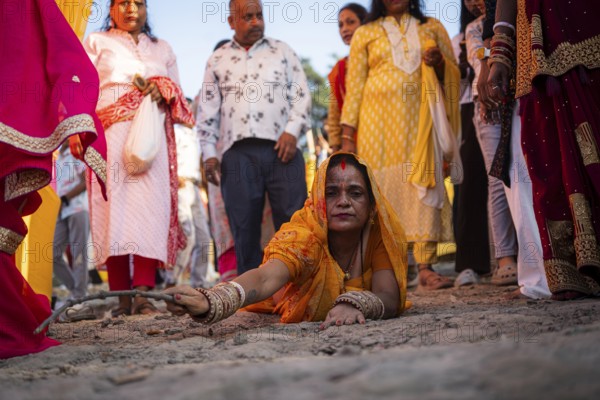 Hindu devotees perform rituals as they offer prayers to the Sun god in the bank of Brahmaputra river on the occasion of the 'Chhath Puja' festival in Guwahati, Assam, India on 7 November 2024. Chhath Puja is a significant Hindu festival celebrated primarily in the Indian states of Bihar, Jharkhand, Uttar Pradesh, and in Nepal. Dedicated to the worship of the Sun God (Surya) and his wife Usha (also referred to as Chhathi Maiya), this festival seeks blessings for prosperity, health, and longevity