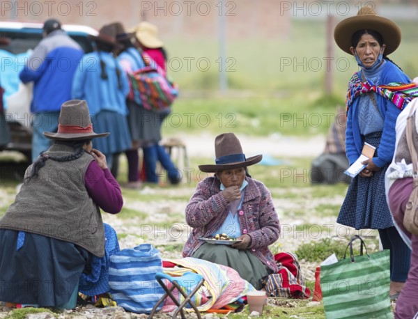Peruvian woman in traditional traditional costume at the indigenous market in Chinchero, Cusco region, Peru, South America