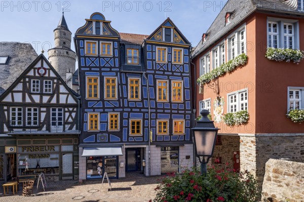 The leaning house, half-timbered house, colourfully painted, witches' tower, town hall, King Adolf Square, historic old town, Idstein, Rheingau Taunus district, German Half-Timbered House Route, Hesse, Germany, Europe