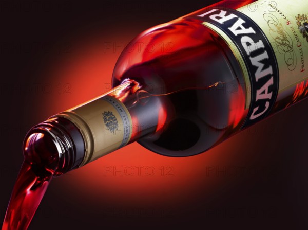 Campari is poured from the bottle