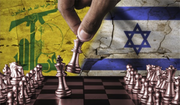 Israel vs Hezbollah flag concept on chessboard. War between Hezbollah and Israel. Conflict between Hezbollah and Israel on pieces of chessboard