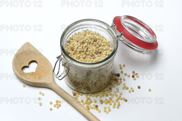 Fregola in glass container, pasta variety from Sardinia, Italy, Europe