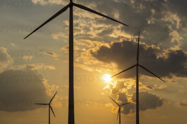 Wind farm, wind turbine, wind turbines, in front of sunset, storm clouds, Swabian Alb, Baden-Württemberg, Germany, Europe